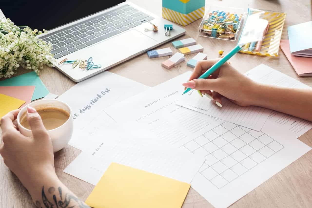 A desk with person working personal budgeting