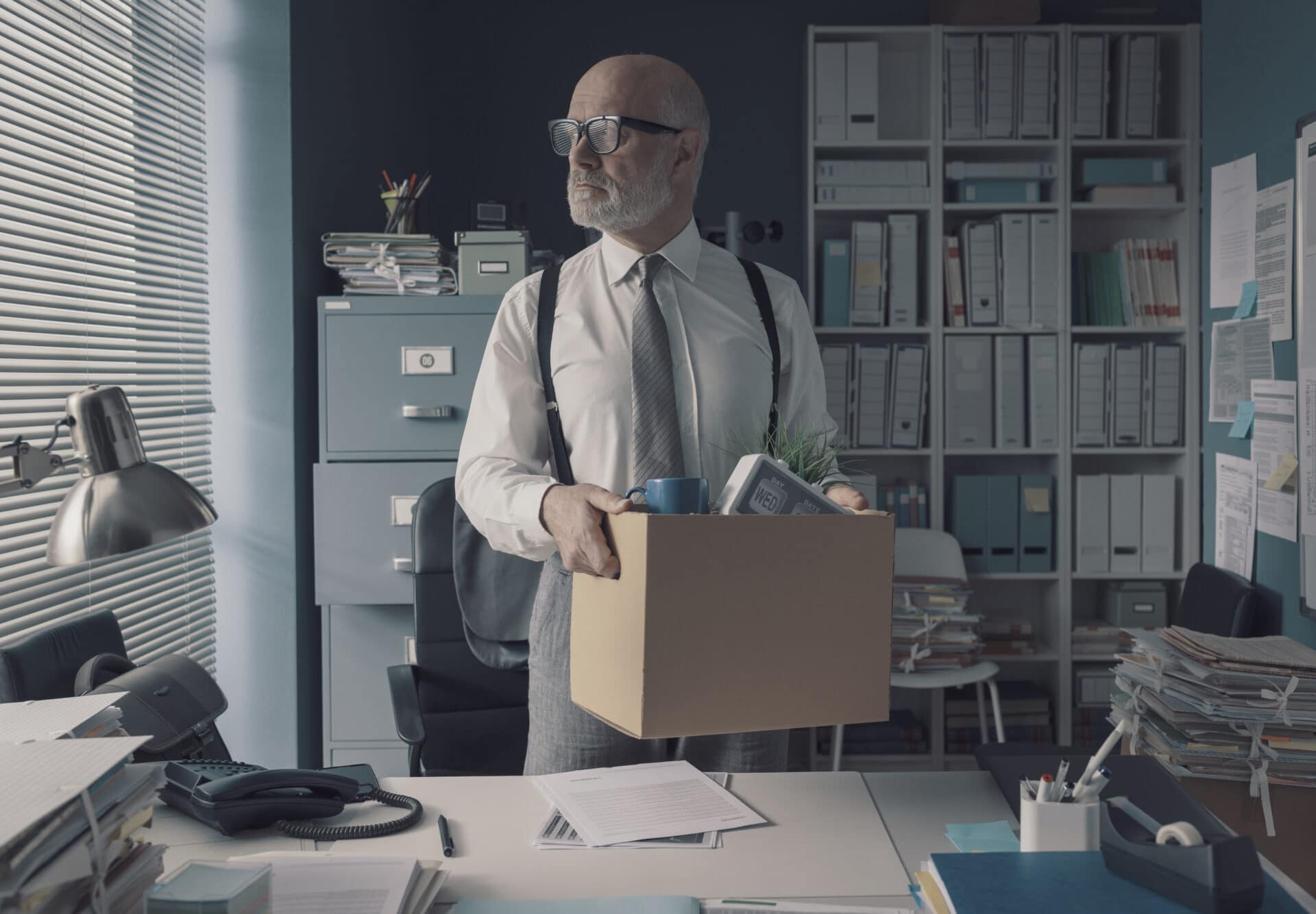 businessman packing and leaving the office
