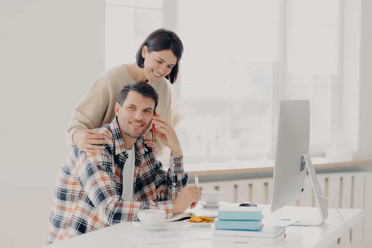 caring woman helps husband entrepreneur