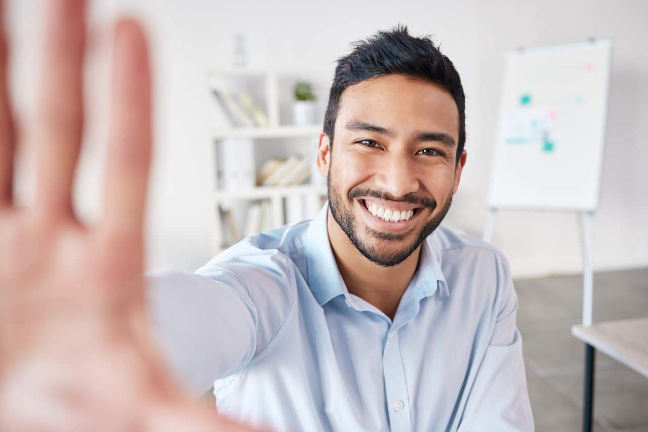 Smiling mixed race hispanic businessman