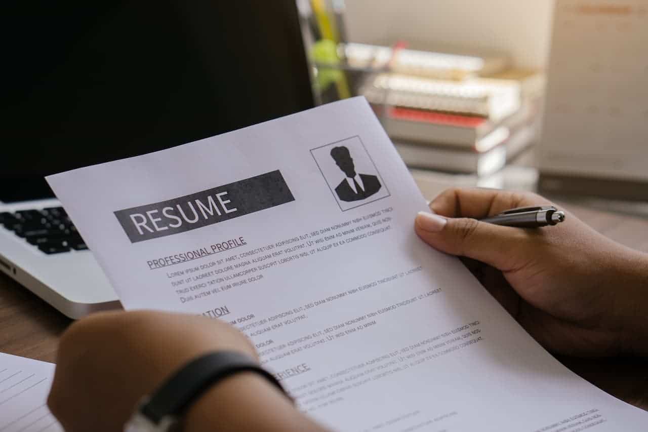 Hand of man holding resume