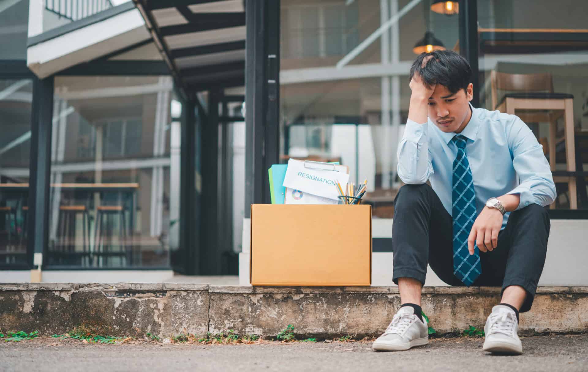 young company employee stressed after resigning from work to find a new job , was fired by the company or when the employment contract expires, resulting in being unemployed